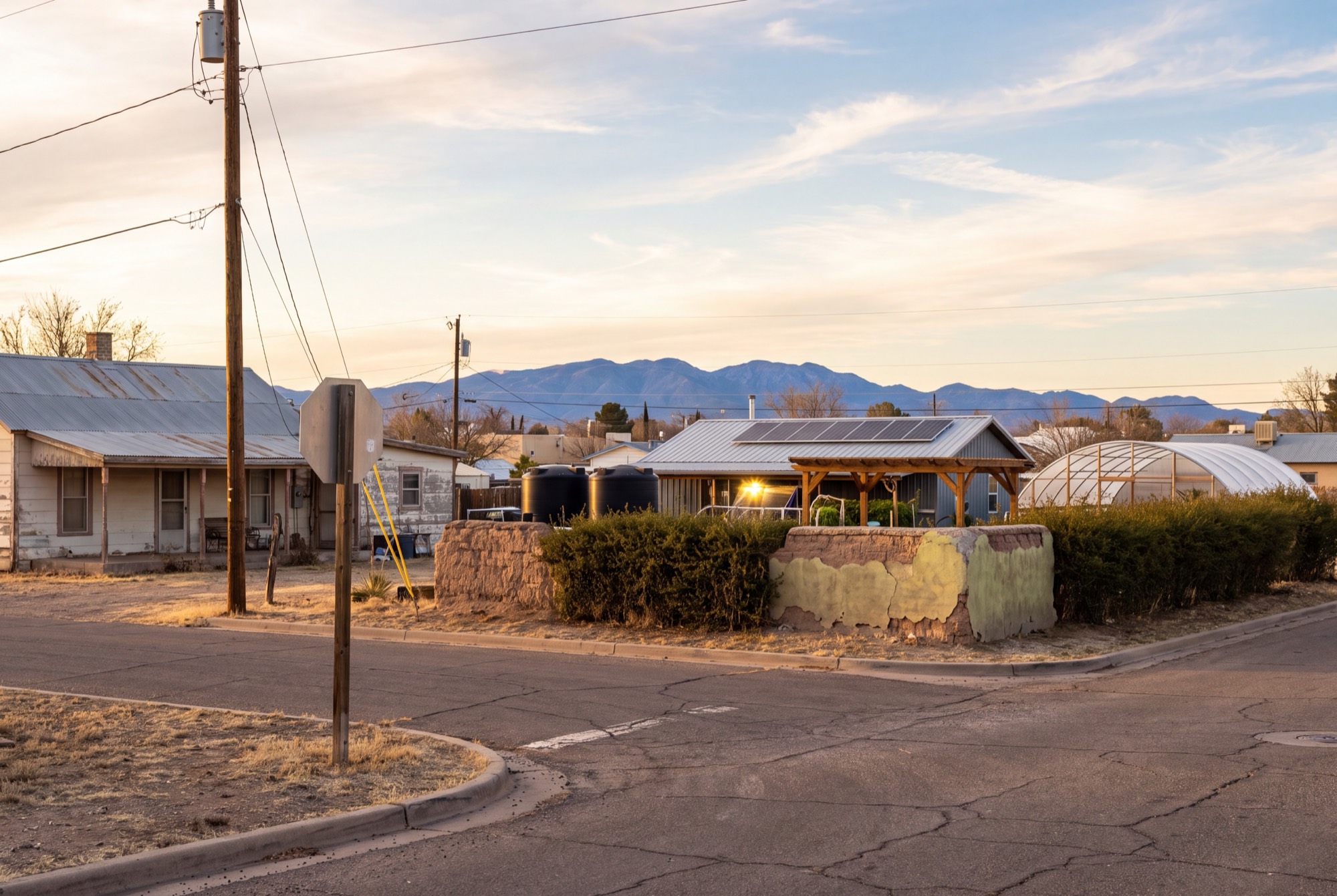 Street-level render of the Aparejo farm entrance at golden hour