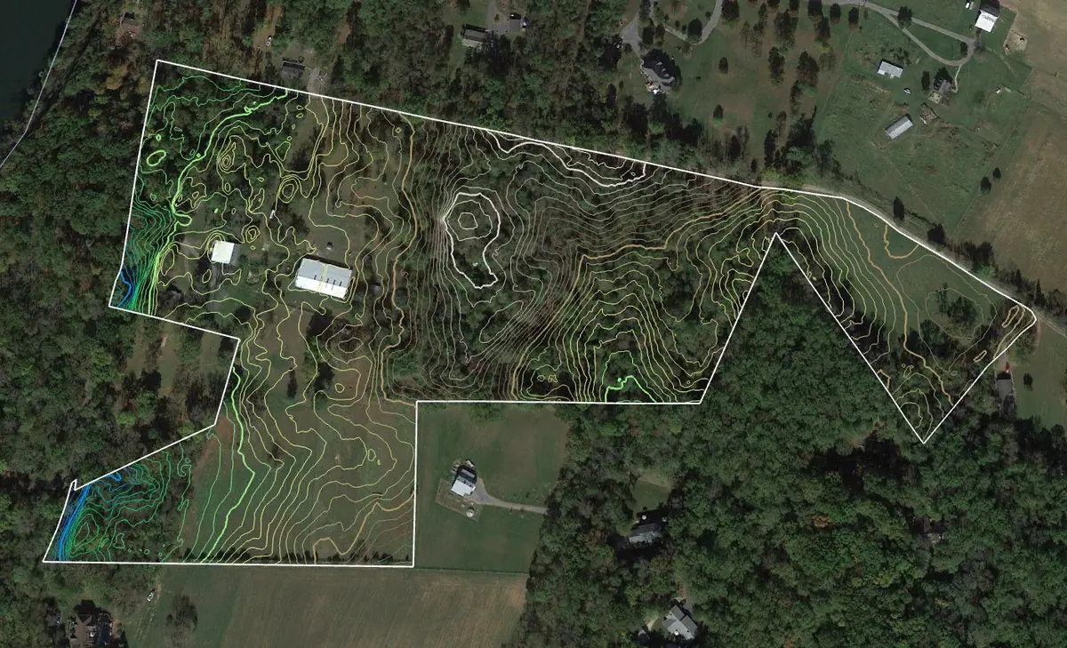 Contour lines drawn over the aerial base, showing the shape of the ground.